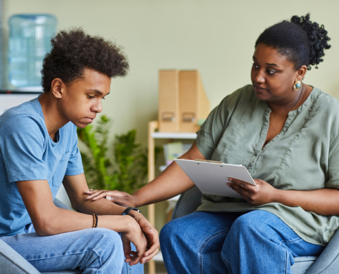 Child going through a mental health evaluation with a counselor.