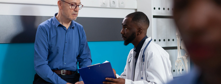 A patient talking with a primary care physician.