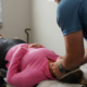 A patient at their first visit to a chiropractor.