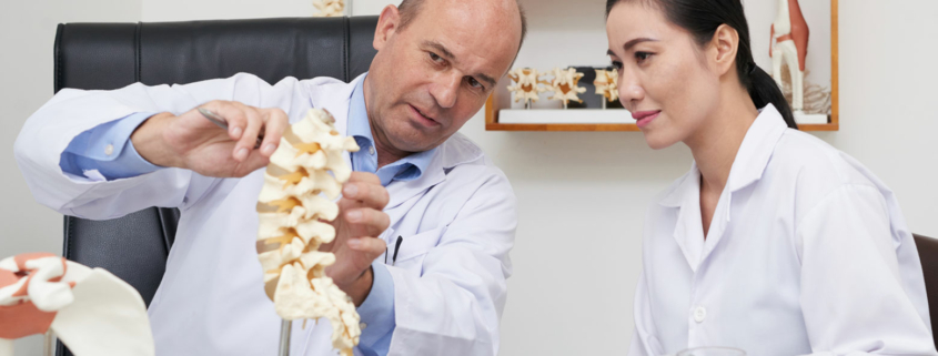 A patient talking with a chiropractor about chiropractic myths.