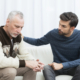 A loved one provides comfort to a grieving person going through the stages of loss.