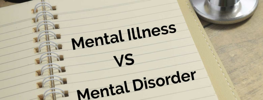 A notebook displaying the words Mental Illness vs. Mental Disorder.
